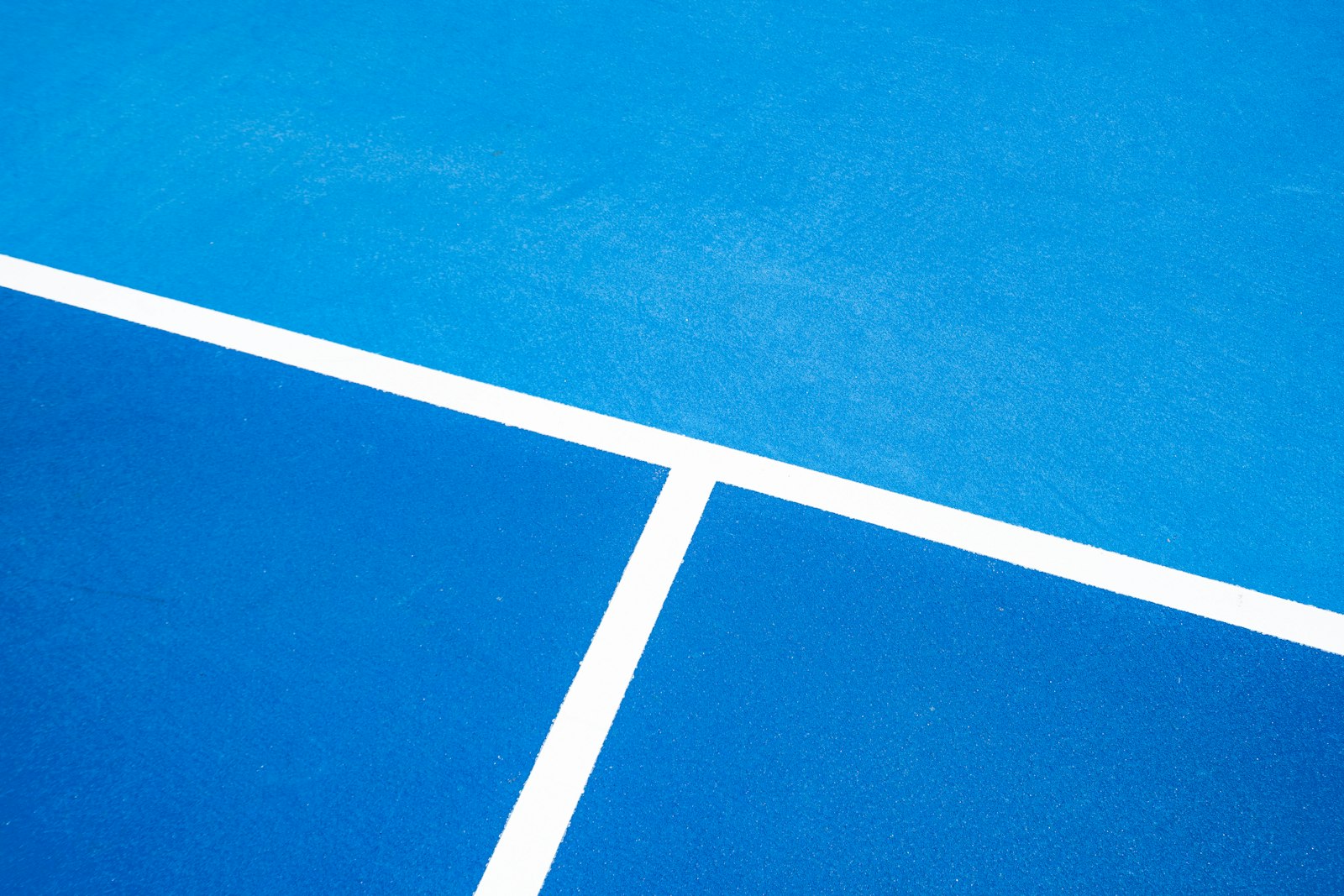 Painted white lines on a blue court